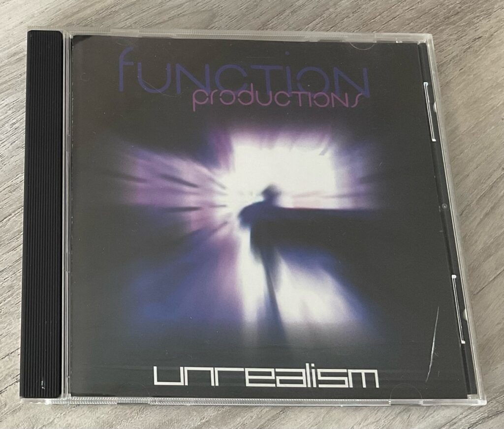 A copy of the 90s punk rock compilation CD: Unrealism (released by Function Productions).