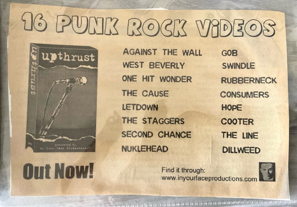 A cutout of a print ad advertising the VHS punk rock video compilation, Upthrust by In Your Face Productions.