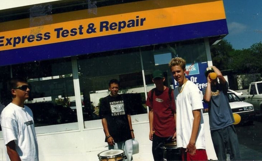 A candid band photo of the 90s punk band: Gimp (taken at an Arco gas station grand opening event we played).